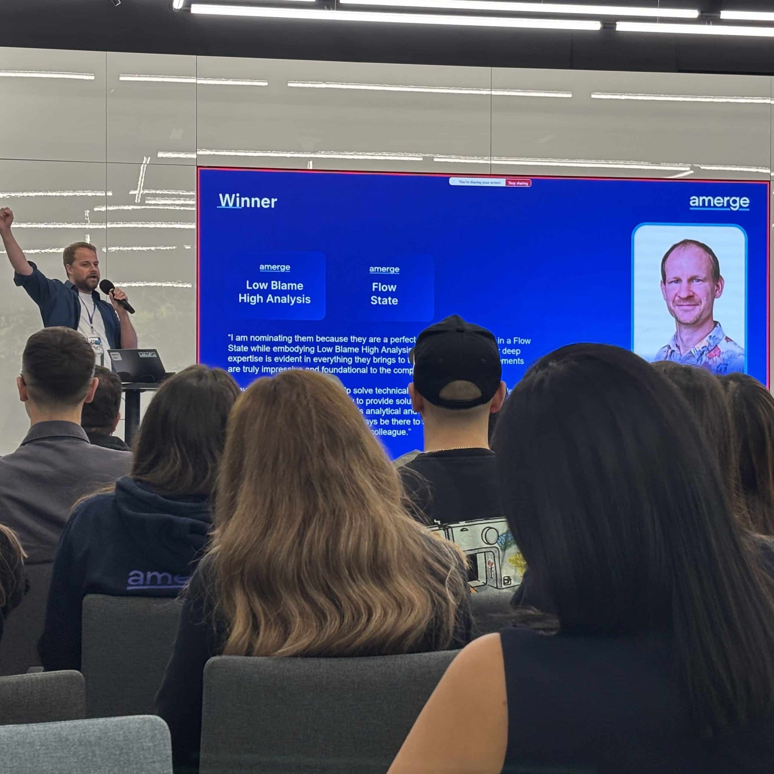 Amerge founder announcing the winner of the 2025 company awards on stage, celebrating team achievements and excellence. Amerge founder announcing the winner of the 2025 company awards on stage, celebrating team achievements and excellence.